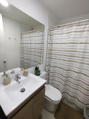 Hair dryer, towels, soap, toilet paper