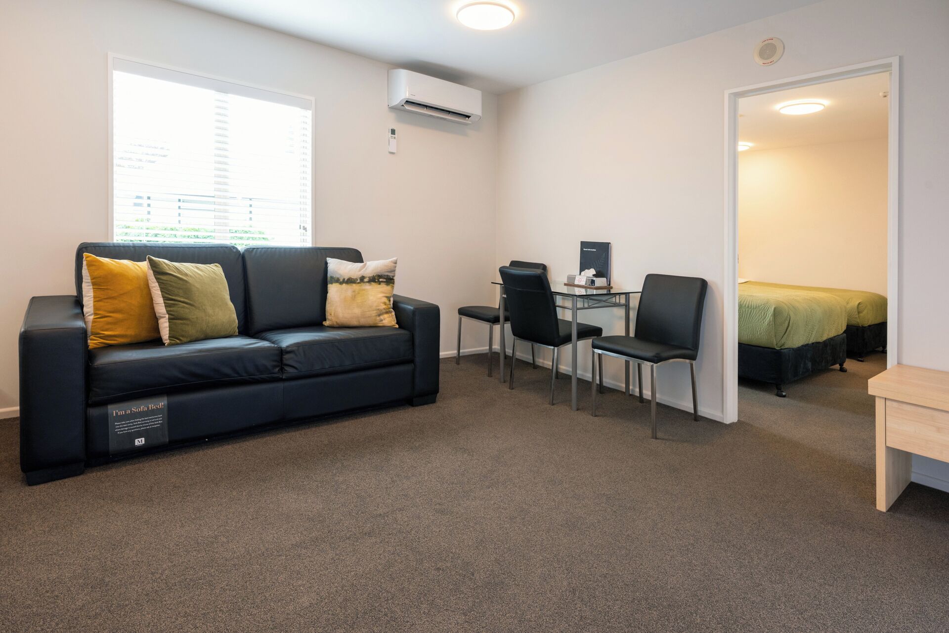 One-Bedroom Suite | Living area | 40-inch Smart TV with satellite channels, Netflix, streaming services