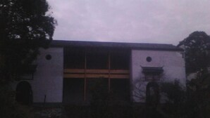 A building with a large central window and two smaller windows on either side. - Qingyuan Renjia Inn (Wuyuan)