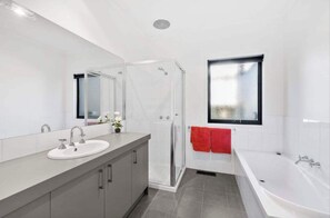 Shower, hair dryer, towels, shampoo