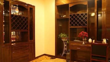 A traditional wooden room with built-in cabinets and a desk.