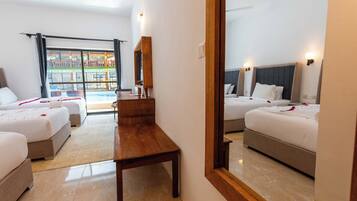 Luxury Triple Room | Minibar, desk, laptop workspace, soundproofing