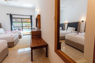 Luxury Triple Room | Minibar, desk, laptop workspace, soundproofing