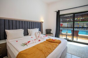 Luxury Double Room, Pool View | Minibar, desk, laptop workspace, soundproofing