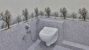 Un baño con inodoro, ducha y lavamanos.