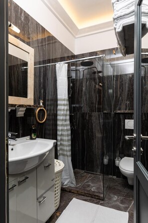 Apartment, 1 Bedroom | Bathroom | Bathrobes, slippers, toilet paper