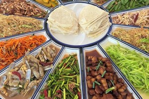 A variety of dishes arranged in a circular pattern around a central plate. - Xiangshan Jiayi Sisters Holiday Villa (Xiangshan)