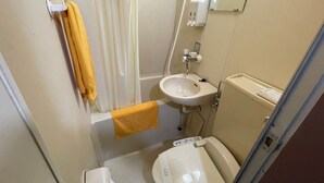 A small bathroom with a sink, toilet, and a towel hanging on the wall. - BUSINESS HOTEL KUDAMATSU (Kudamatsu)