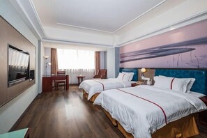 A hotel room with two beds, a desk, a TV, and a painting on the wall. - Yiting Business Hotel (Quanzhou)