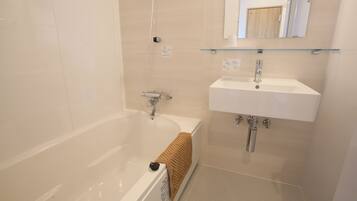 Hair dryer, towels, shampoo, toilet paper