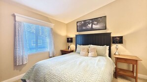 A bedroom with a bed, two bedside tables, a window with curtains, and a wall-mounted picture. - #1-cnvnt 4B3B fits 9PPL, 15 mins walk to heavenly (South Lake Tahoe)