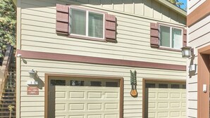 A two-story house with a garage, a small porch, and a street lamp. - #1-cnvnt 4B3B fits 9PPL, 15 mins walk to heavenly (South Lake Tahoe)