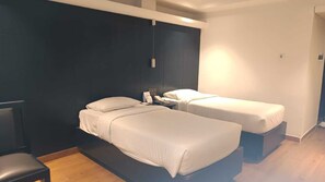Deluxe Twin Room | Desk, laptop workspace, iron/ironing board, rollaway beds - Regenta Inn Downton Raipur (Raipur)