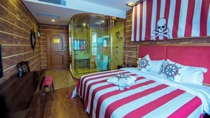 A room with a bed, a wooden wall, a glass door, and a striped headboard. - Fulong Hotel (Ya'an)