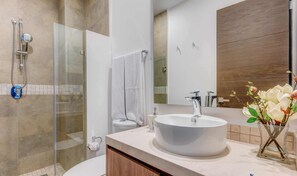 Shower, hair dryer, towels, soap