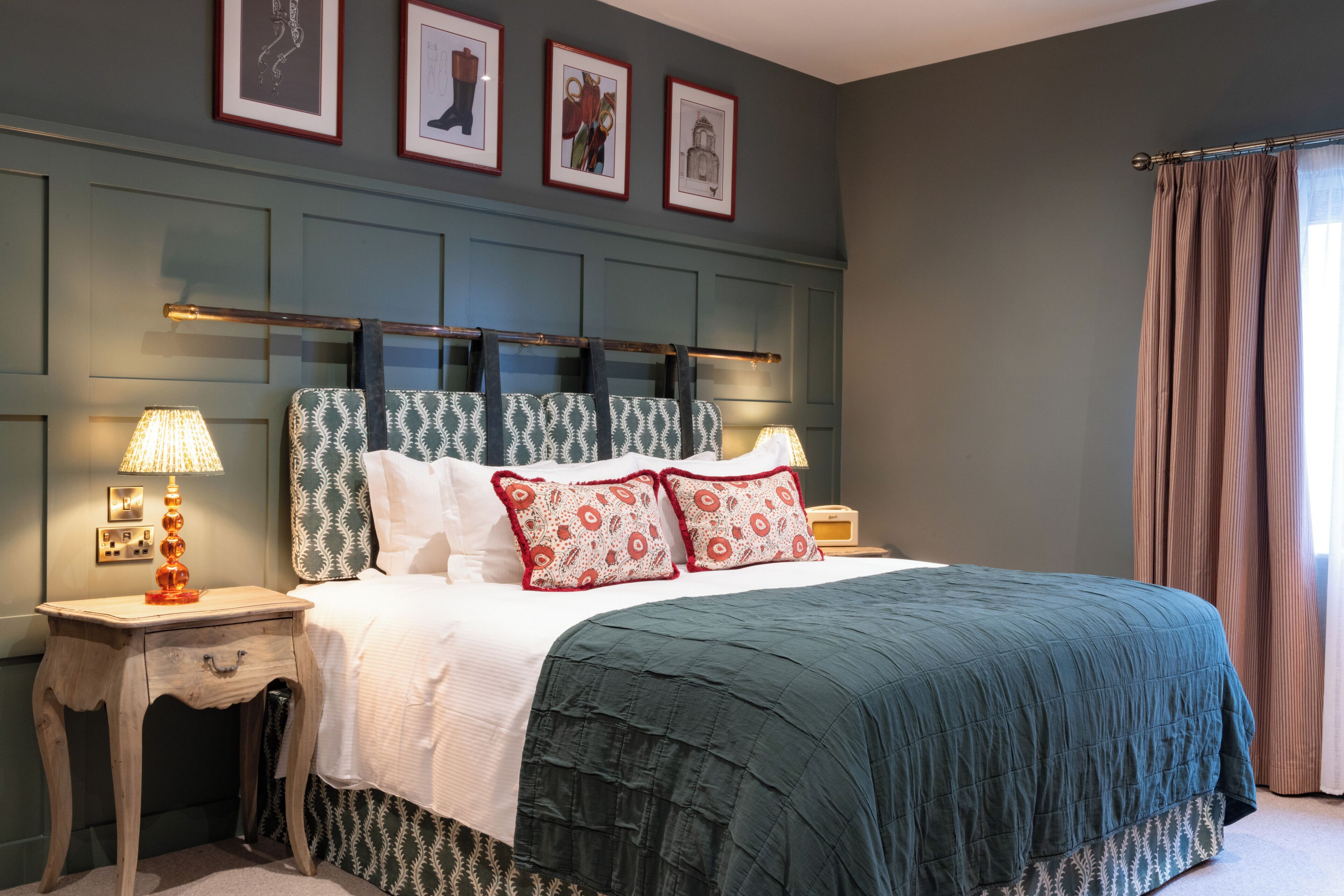 A neatly arranged bedroom with a bed, two bedside tables, and a headboard.