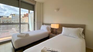 Apartment, 3 Bedrooms, Balcony | Desk, iron/ironing board, bed sheets