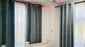 Deluxe Apartment, 2 Bedrooms, Pool View | 1 bedroom, desk, laptop workspace, soundproofing