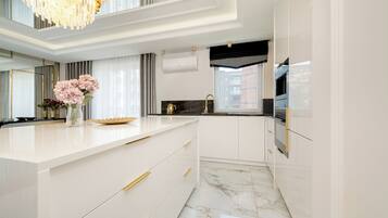 Apartment, 1 Bedroom, Balcony | Private kitchenette | Oven, coffee/tea maker, freezer, dining tables