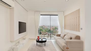 Apartamento Business | Zona de estar | Smart TV de 55 pulgadas con canales digitales