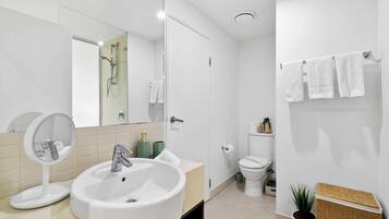 Shower, hair dryer, towels, shampoo