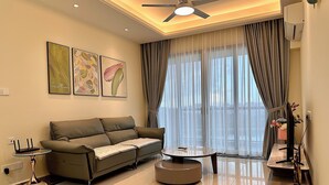 Superior Condo, 2 Bedrooms, Balcony, Sea View | Living area | 50-inch Smart TV with cable channels, ping pong - R&F Superior Homestay By Han Lin Sojourn (Johor Bahru)