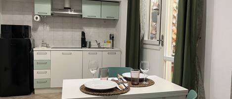 Fridge, microwave, stovetop, coffee/tea maker
