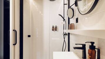 Shower, eco-friendly toiletries, hair dryer, towels