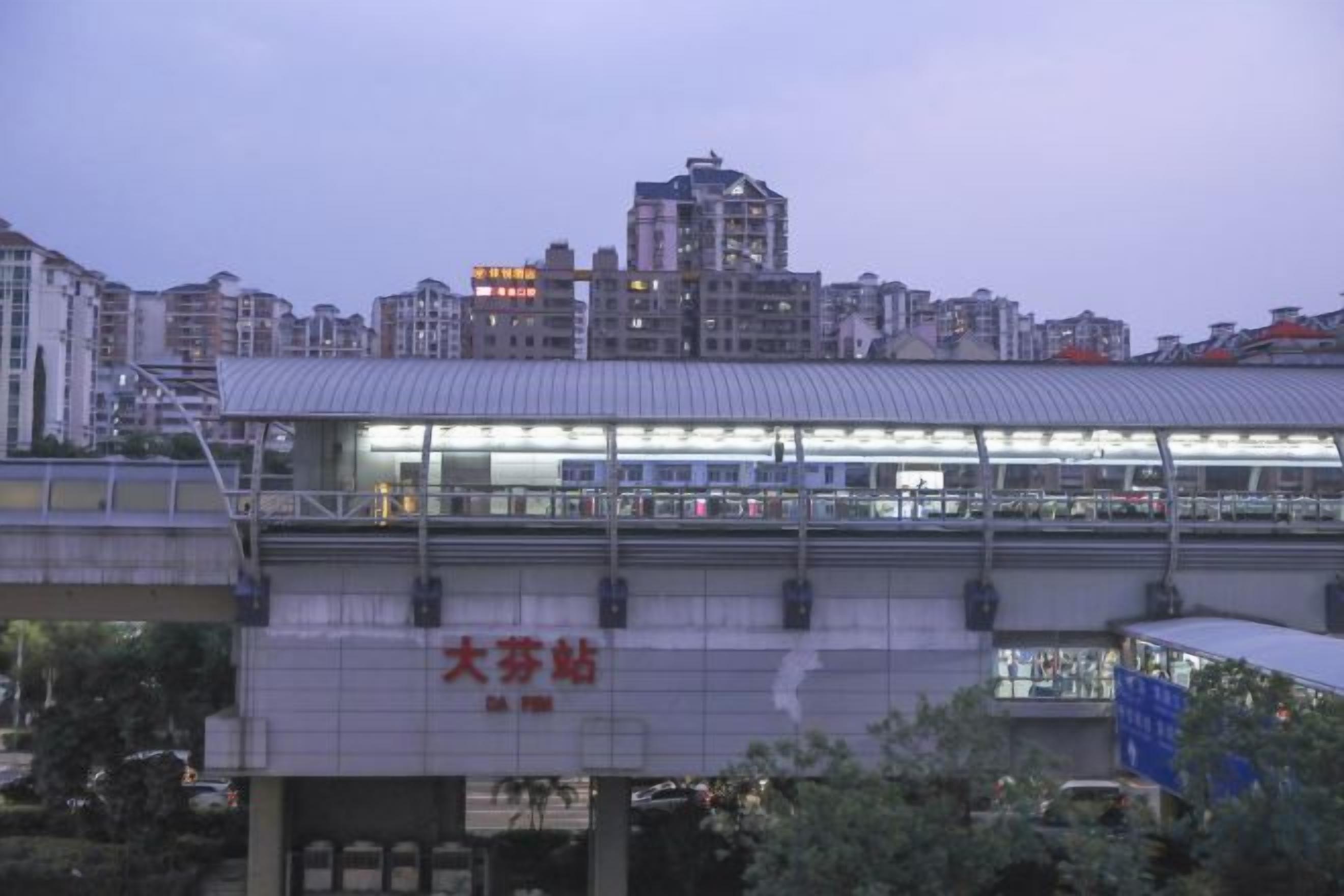 A modern building with a flat roof and a large glass facade, likely a commercial or public facility.