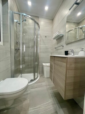 Shower, hair dryer, towels, soap