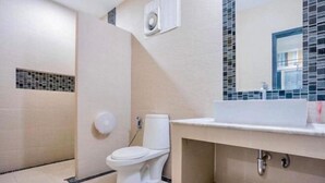 A modern bathroom with a toilet, sink, and mirror. - Baan Bonhuer Pool Villa Hua-Hin (Hua Hin)