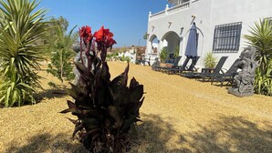 A building with a white facade, black railings, and a gravel courtyard. - 3beds Villa w/ Pool - Near Almeria Beaches (Cantoria)