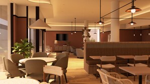Un interior de restaurante moderno con mesas redondas, sillas e iluminación colgante.