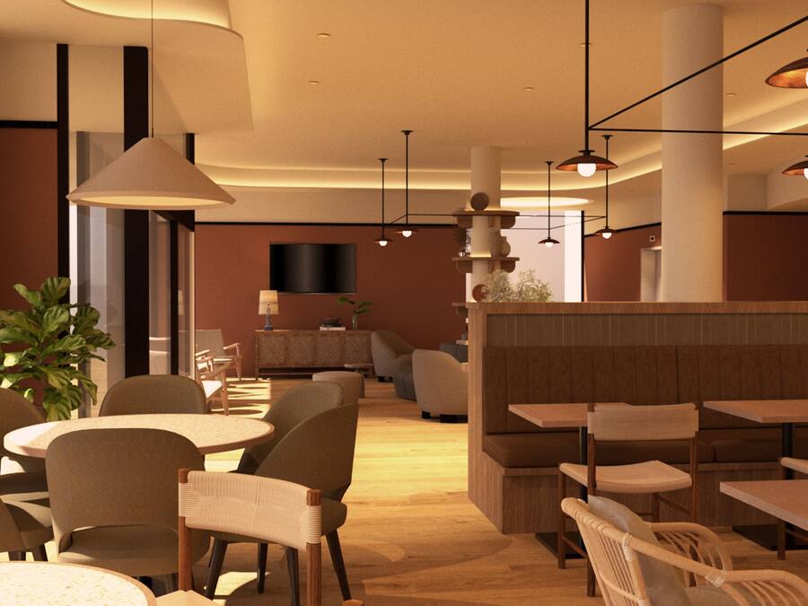 A modern restaurant interior with round tables, chairs, and pendant lighting.
