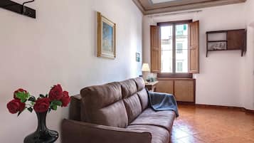 Apartment | Living area | 24-inch flat-screen TV with digital channels, fireplace