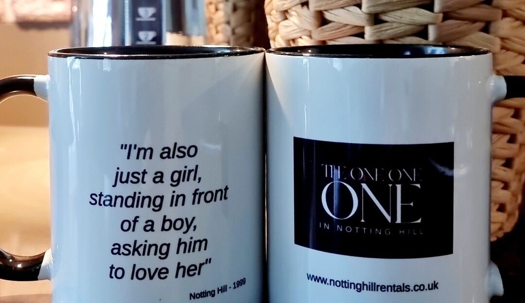 Two mugs with text, one with a quote and the other with a logo.