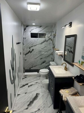 Shower, hair dryer, towels, soap