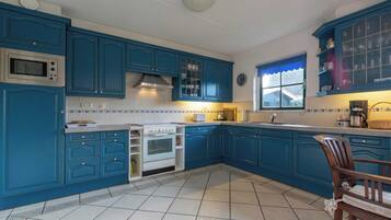 Villa | Private kitchen | Electric kettle, toaster, high chair