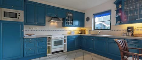 Villa | Private kitchen | Electric kettle, toaster, high chair