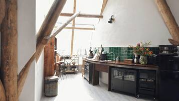 Villa | Private kitchen | Stovetop, electric kettle, toaster, high chair