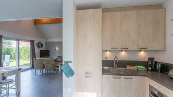 Villa | Private kitchen | Stovetop, electric kettle, toaster, highchair