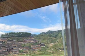 Unclassified image, 4 of 43, button - Xijiang miao village listen to tao xuan hotel (Leishan)