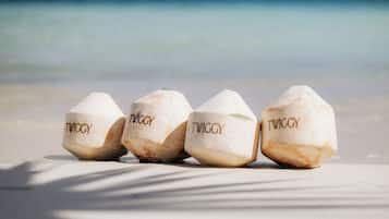 Four sugar cubes labeled "TWIGGY" on a beach.