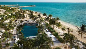 A resort with a pool, beach, and ocean view. - SLS Playa Mujeres – ALL Inclusive Collection (Punta Sam)