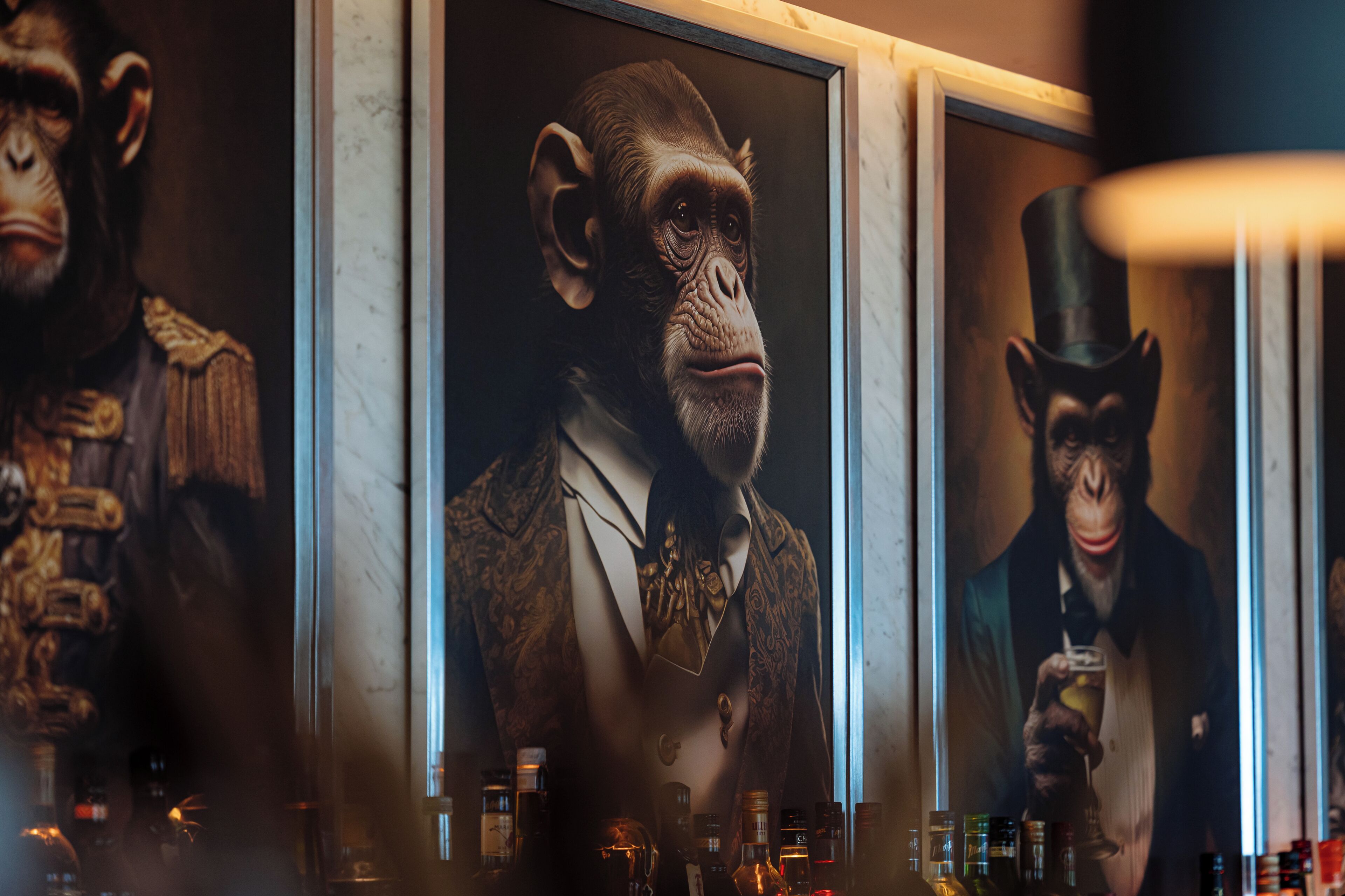 A framed portrait of a chimpanzee in a suit.