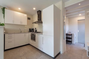 Private kitchen - Cozy Holiday Home Near Dunes (Sint Maartensvlotbrug)