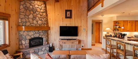 Smart TV, fireplace, books, stereo