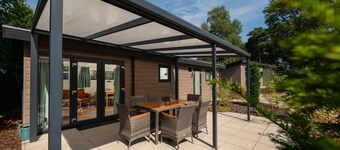 The Veluwe Lodge offers luxury and space for 5 guests with modern amenities in a serene, green setting.