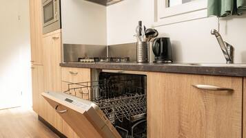 Microwave, dishwasher, coffee/tea maker, dining tables