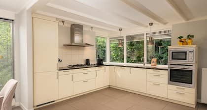 Central luxury group villa with hot tub, five bedrooms, large kitchen, and fenced garden. Plenty of privacy and comfort both indoors and outdoors.